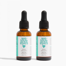 Load image into Gallery viewer, Two bottles of 'we love eyes' eye serum on a white background