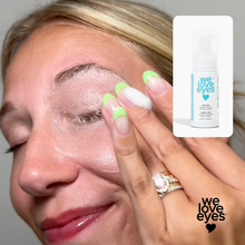 Load image into Gallery viewer, Close-up of a woman applying eye cream with 'we love eyes' branding.