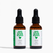 Load image into Gallery viewer, Two bottles of 'we love eyes' rosemary eye and skin oil on a white background