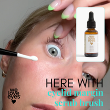 Load image into Gallery viewer, Person applying eyelid margin scrub brush with 'we love eyes' product inset.
