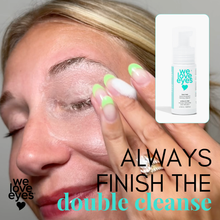 Load image into Gallery viewer, Person applying eye cream with 'we love eyes' product displayed, emphasizing double cleanse routine.

