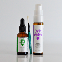 Load image into Gallery viewer, Set of 'we love eyes' eye care products on a reflective surface with a light gray background
