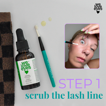 Load image into Gallery viewer, Cosmetic product with applicator and text 'scrub the lash line' on a neutral background
