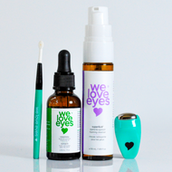 Set of 'we love eyes' skincare products including a dropper bottle, spray bottle, and applicator on a light gray background.