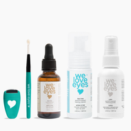 Set of 'we love eyes' eye care products including a dropper, bottle, and sprays on a white background.